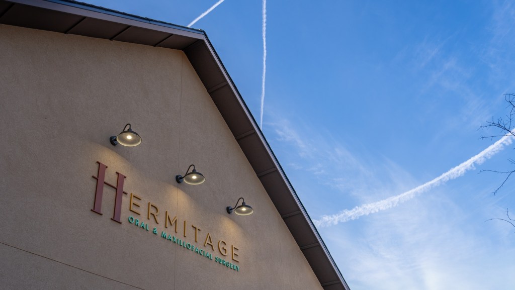 Hermitage Oral Surgery Logo